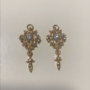 2 gold charms with crystals